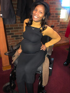 Pregnant Anna Holly who is a wheelchair user.